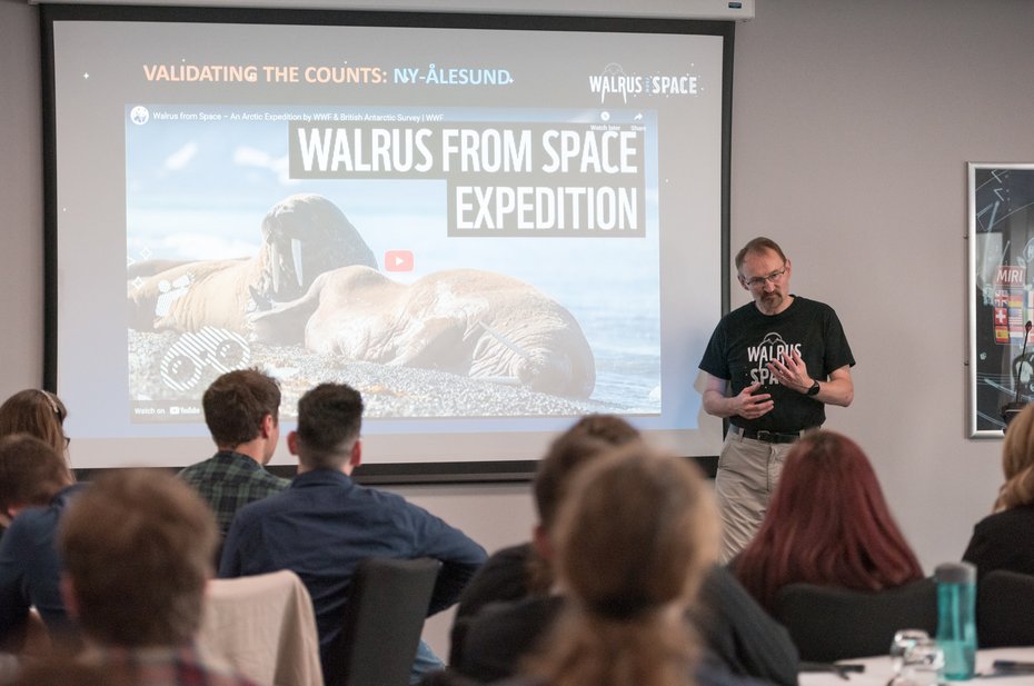 Speaker talking about seeing walrus from space