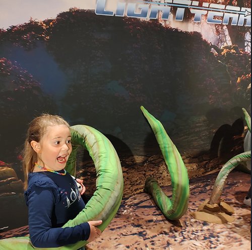 ASDC Lightyear Premiere family day girl in vines.jpg