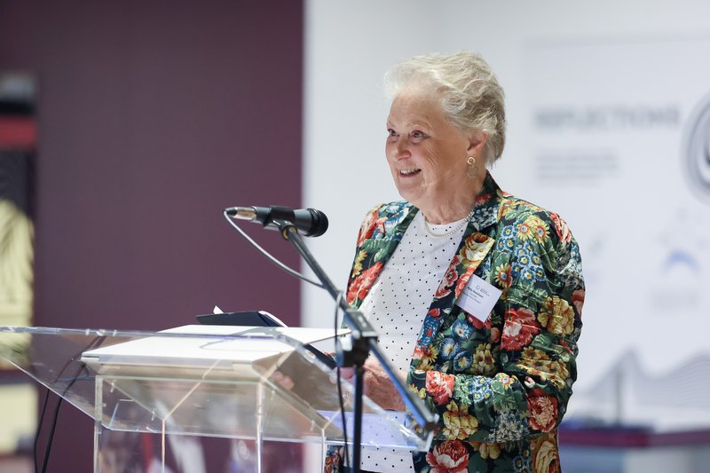 Photo of volunteer of the year award winner Polly Hutchinson speaking at a lectern
