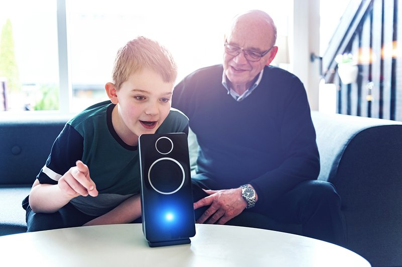 Boy with older man and digital speaker.jpg