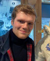 Headshot of Caucasian man with short brown hair