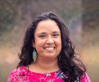 Headshot of a woman with long brown hair