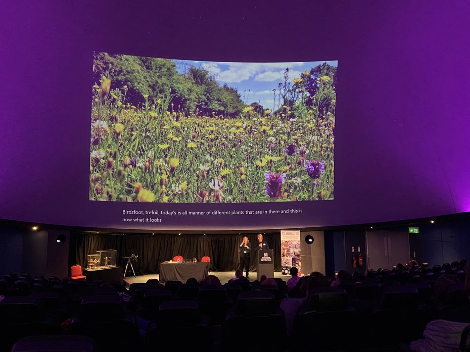 Keynote speaker on stage in the planetarium at Winchester Science Centre
