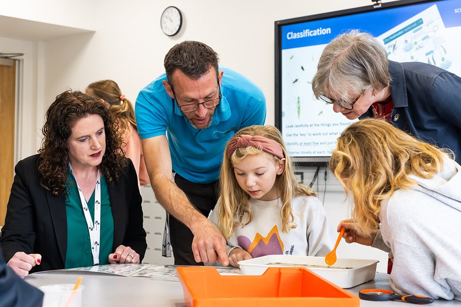 Professor Dame Angela McLean with pupils and staff at Science Oxford Centre