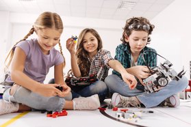 Children playing with Mars Rover Model